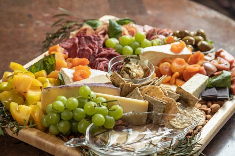 Crafting the Perfect Cheese and Charcuterie Board for Entertaining with an assortment of cheeses, cured meats, fruits, and nuts.